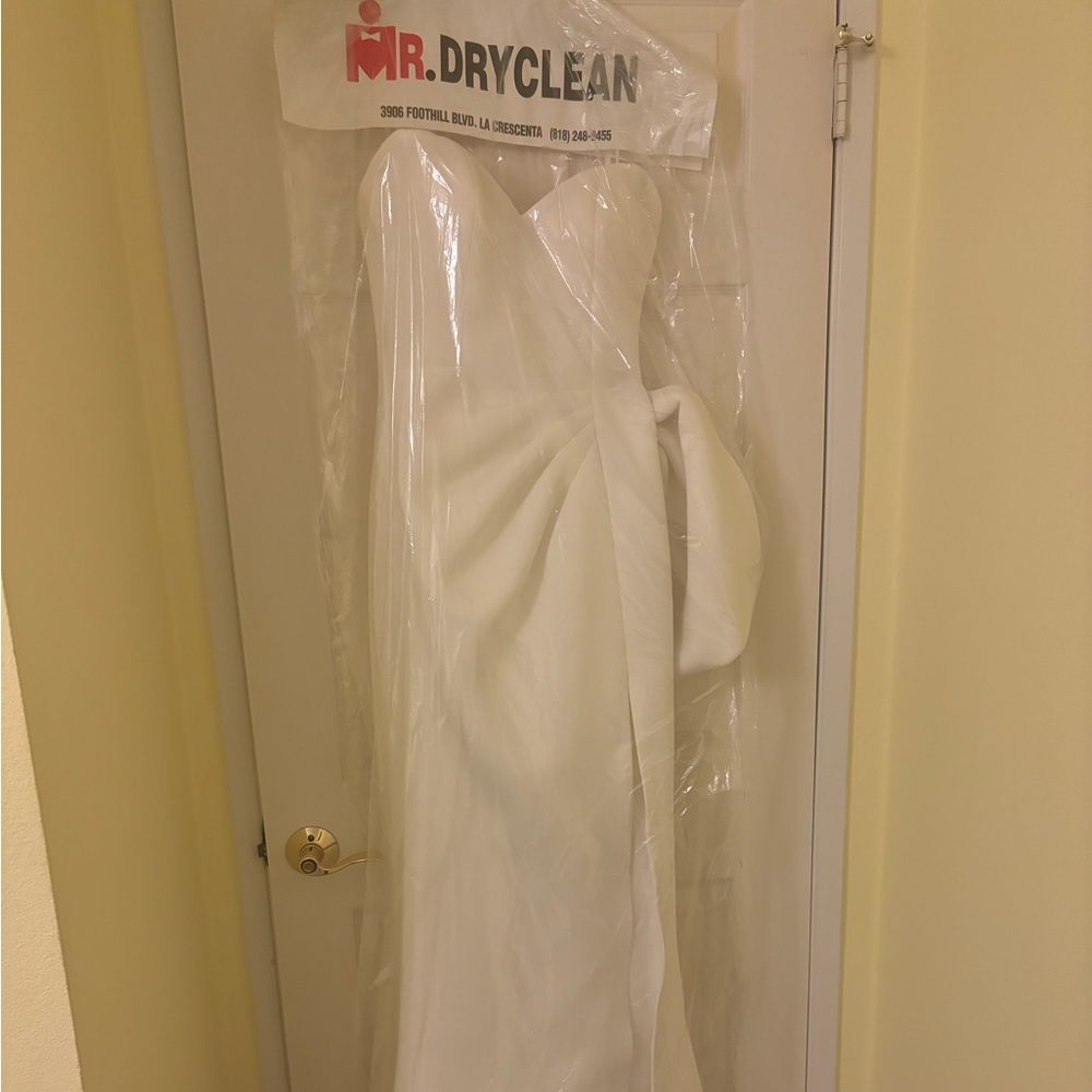 Jovani size 8 Strapless white gown with slit, side bow, and small tail.